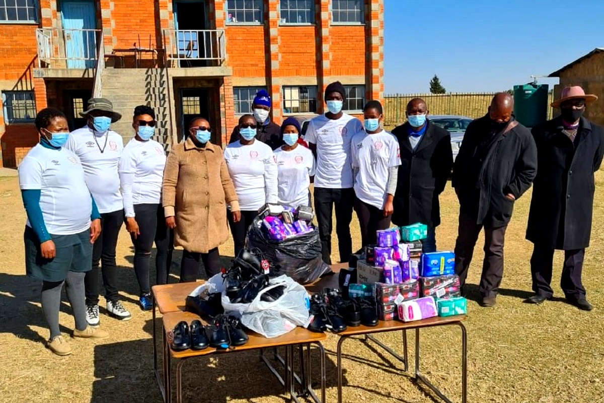 Red Skins donate sanitary towels, shoes to learners