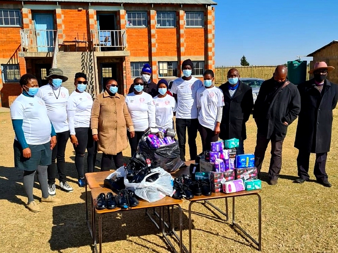 Red Skins donate sanitary towels, shoes to learners